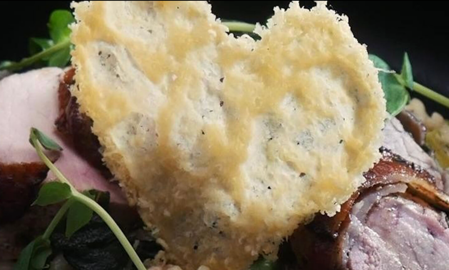 Denhay wrapped Pork Fillet, Crispy Sage, Leek and Pea Risotto